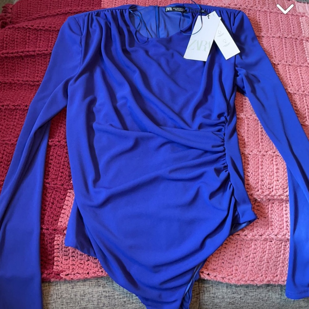 blue/purple body suit